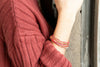 Close-up of nickel-free elastic bracelets with colourful glass and brass beads from Fair Anita's India Collection