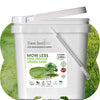 White bucket of Flawn Seed Kits grass seed with a green grass background