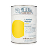 Meliora Laundry Powder Detergent lemon scent in a paper-and-steel canister with stainless steel scoop