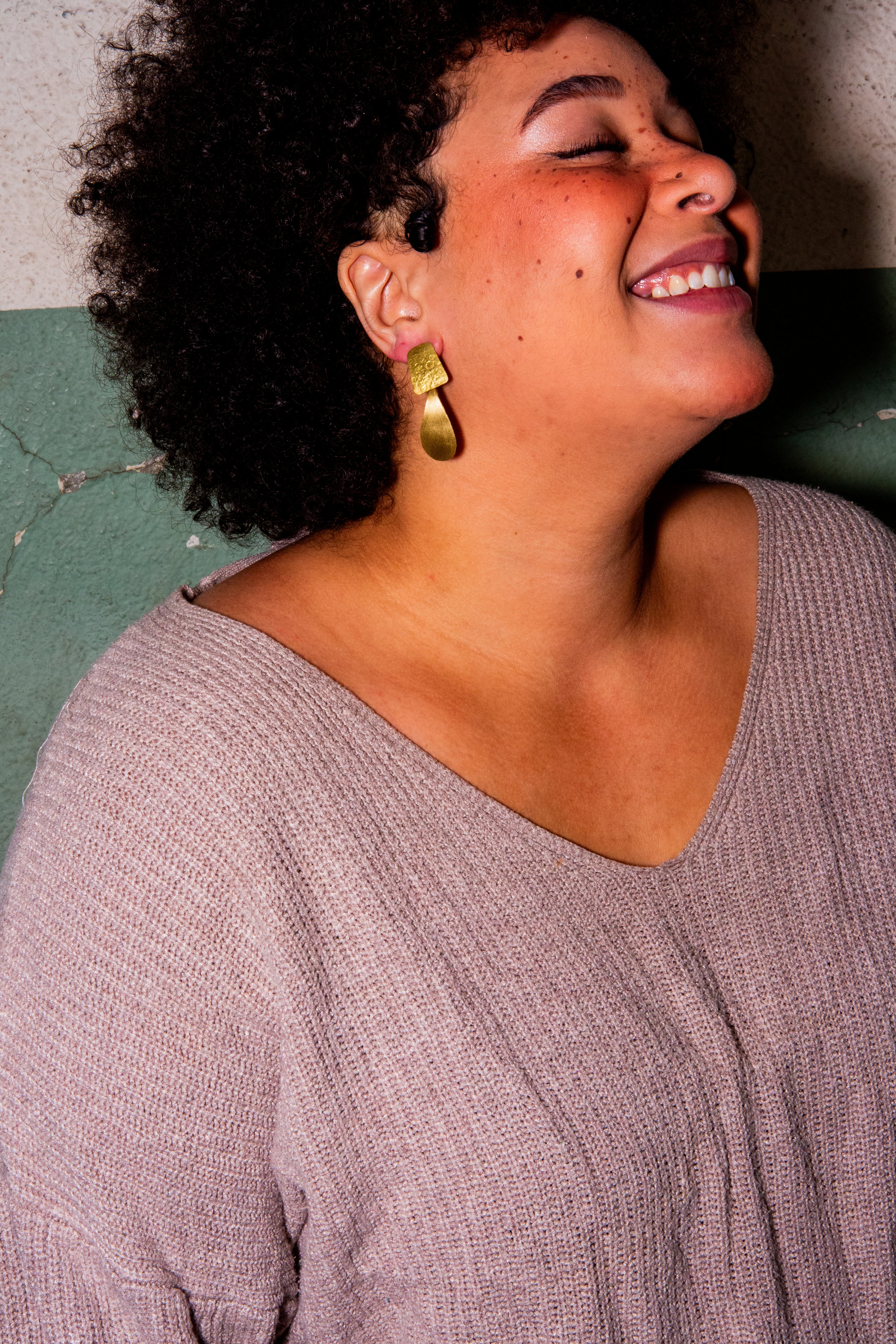 Close-up of Lamp Stud Brass Earrings showing gold-plated finish, handcrafted by women artisans in India