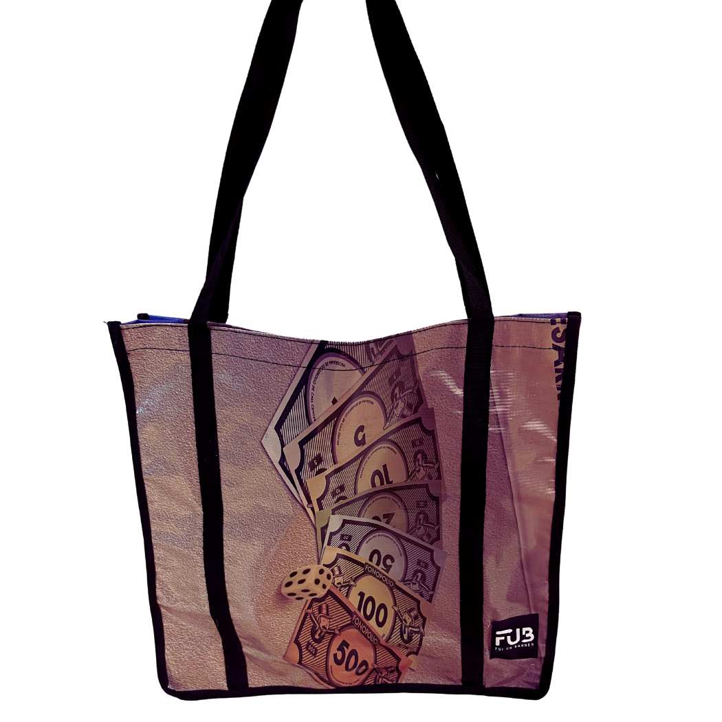 Carry all your essentials in style with our Large Tote Bag. Made from upcycled banners and crafted in Peru, this sustainable and unique bag is perfect for everyday adventures.