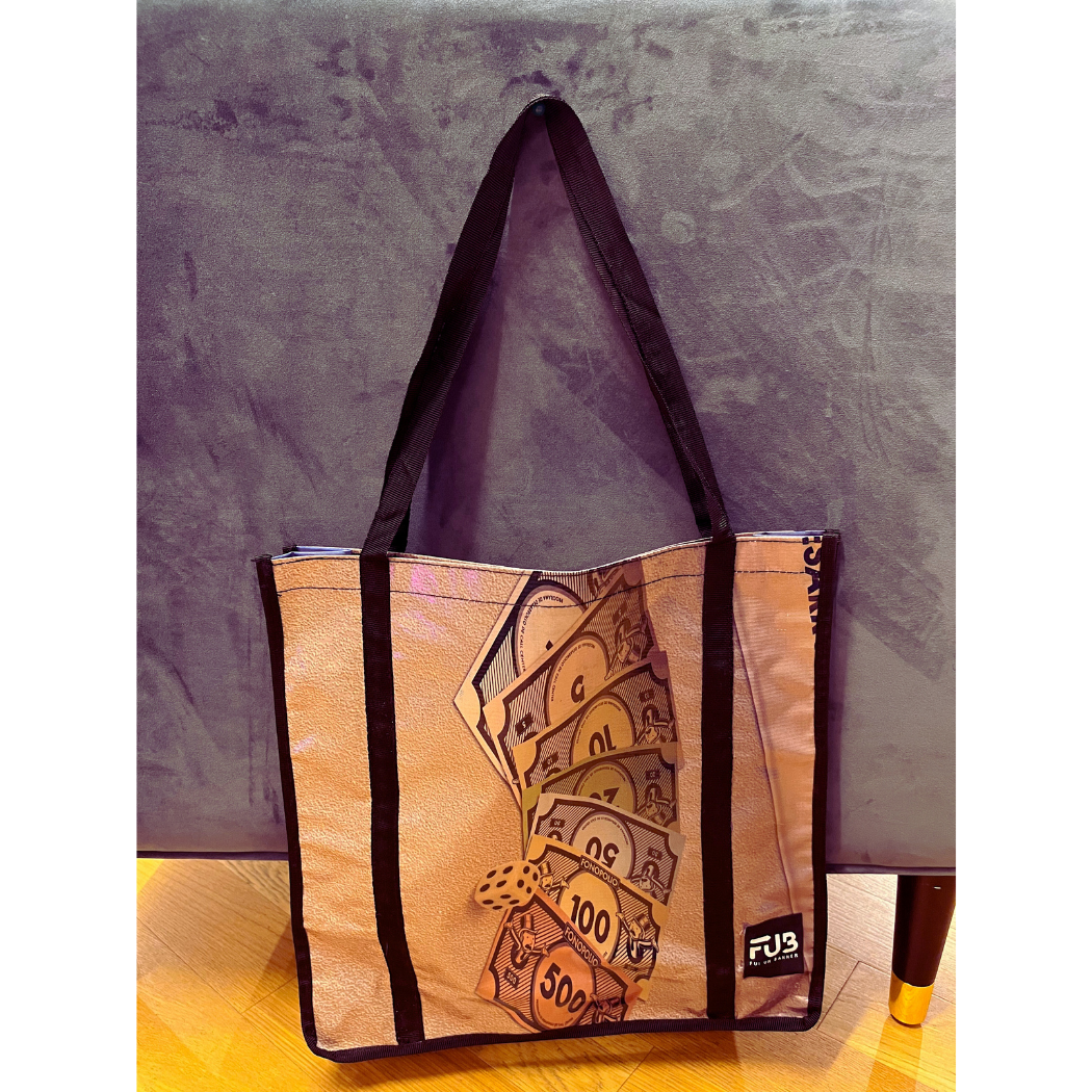 Carry all your essentials in style with our Large Tote Bag. Made from upcycled banners and crafted in Peru, this sustainable and unique bag is perfect for everyday adventures.