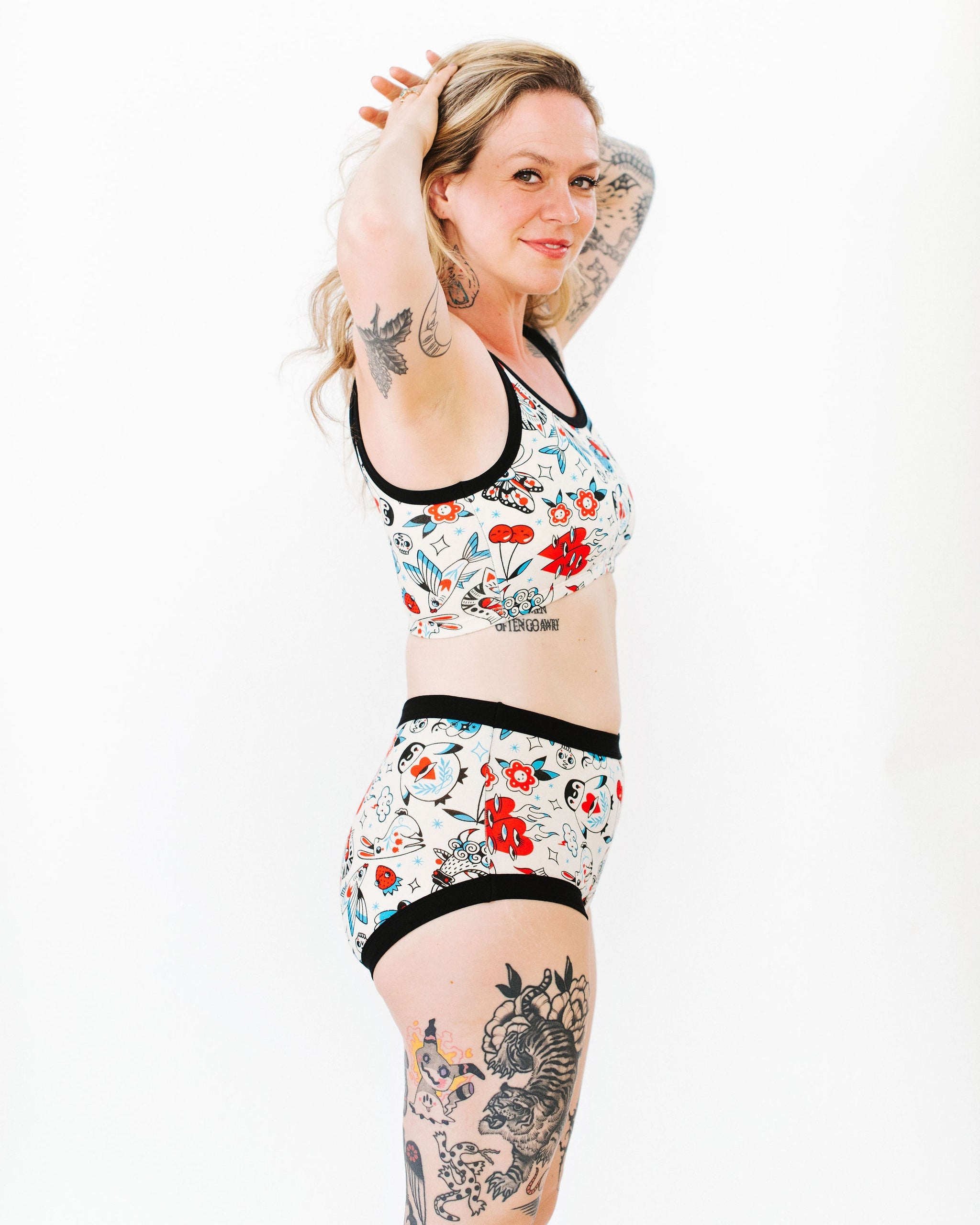 Close-up of Inked Up Longline Bra print with bold tattoo-style artwork by Connie Gabbert