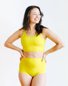Close-up detail of Thunderpants USA Longline Bra in vibrant Star Fruit yellow-green
