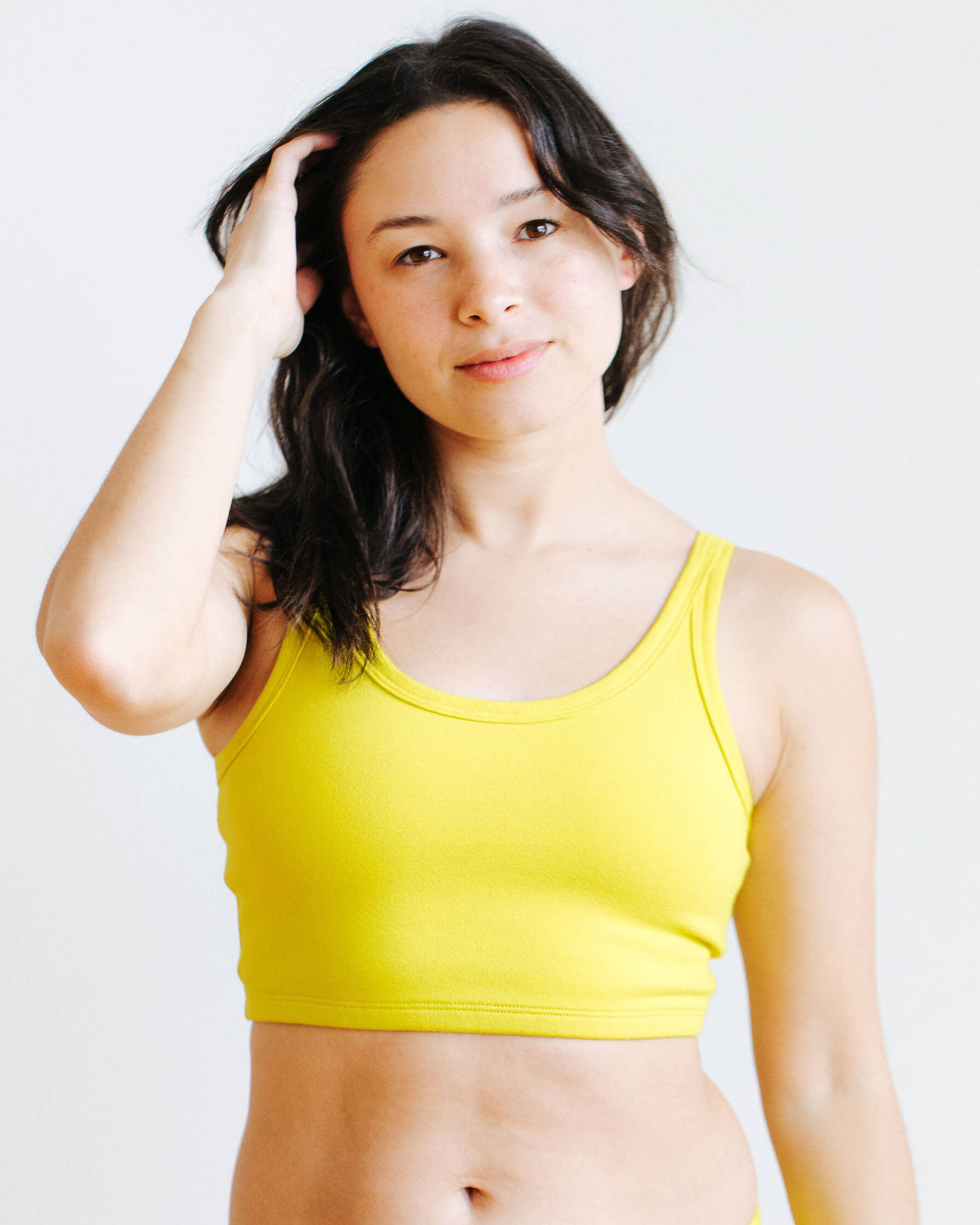 Model wearing Thunderpants USA Star Fruit Longline Bra in size Medium, front view