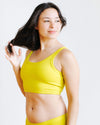 Side view of model wearing the Star Fruit Longline Bra by Thunderpants USA