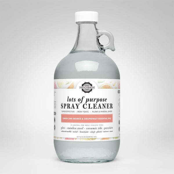 Clear spray cleaner bottle with a label on a white background