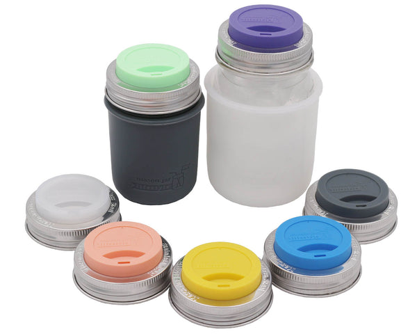 Set of colorful bottle lids on a white background. Transform your Mason jars into eco-friendly tumblers with Silicone Drinking Lids and Stainless Steel Bands from Clozist. BPA-free, LFGB-certified, and dishwasher safe. Perfect for smoothies, coffee, or toddler sippy cups. Shop the sustainable Amazon alternative!