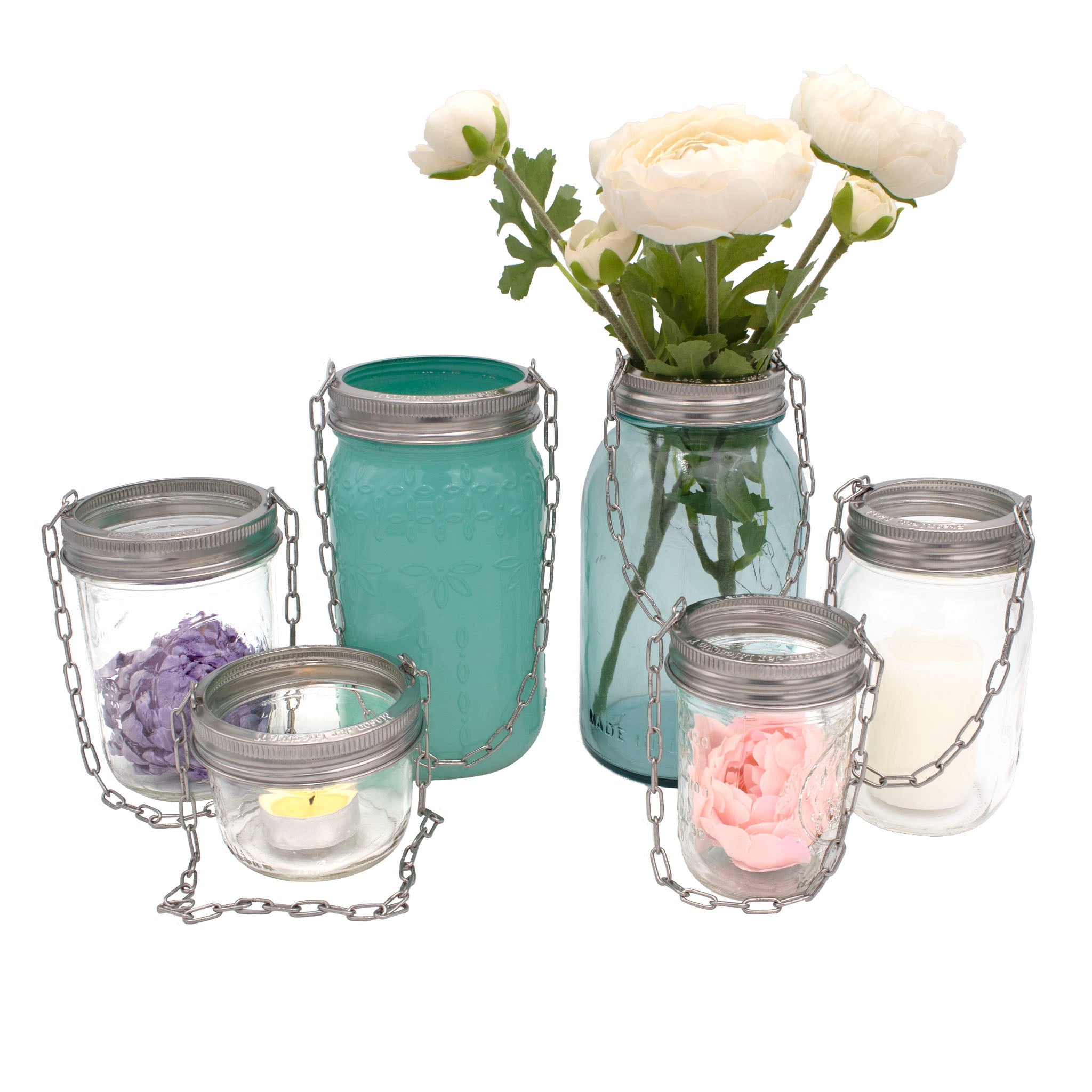 Set of glass jars with floral and candle decorations on a white background