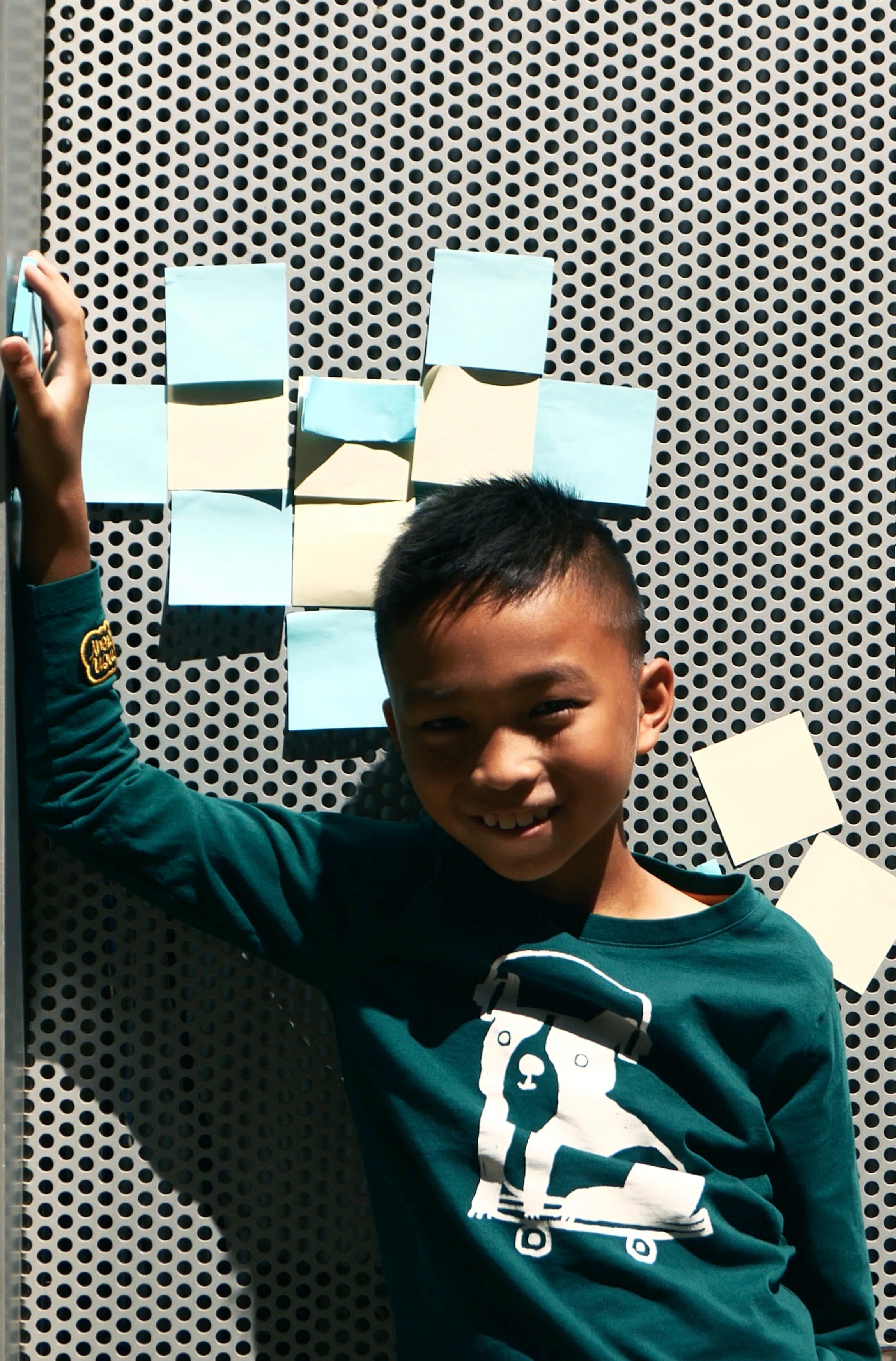 Close-up of Mon Coeur Walter recycled cotton kids t-shirt in pine green showing soft fabric texture and crew neckline