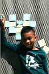 Close-up of Mon Coeur Walter recycled cotton kids t-shirt in pine green showing soft fabric texture and crew neckline