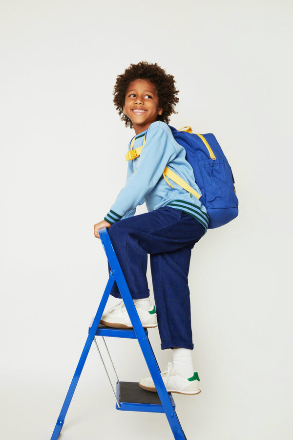 Mon Coeur Kids Navy Grid Corduroy Pant worn by a child, showing the unisex wide-leg design