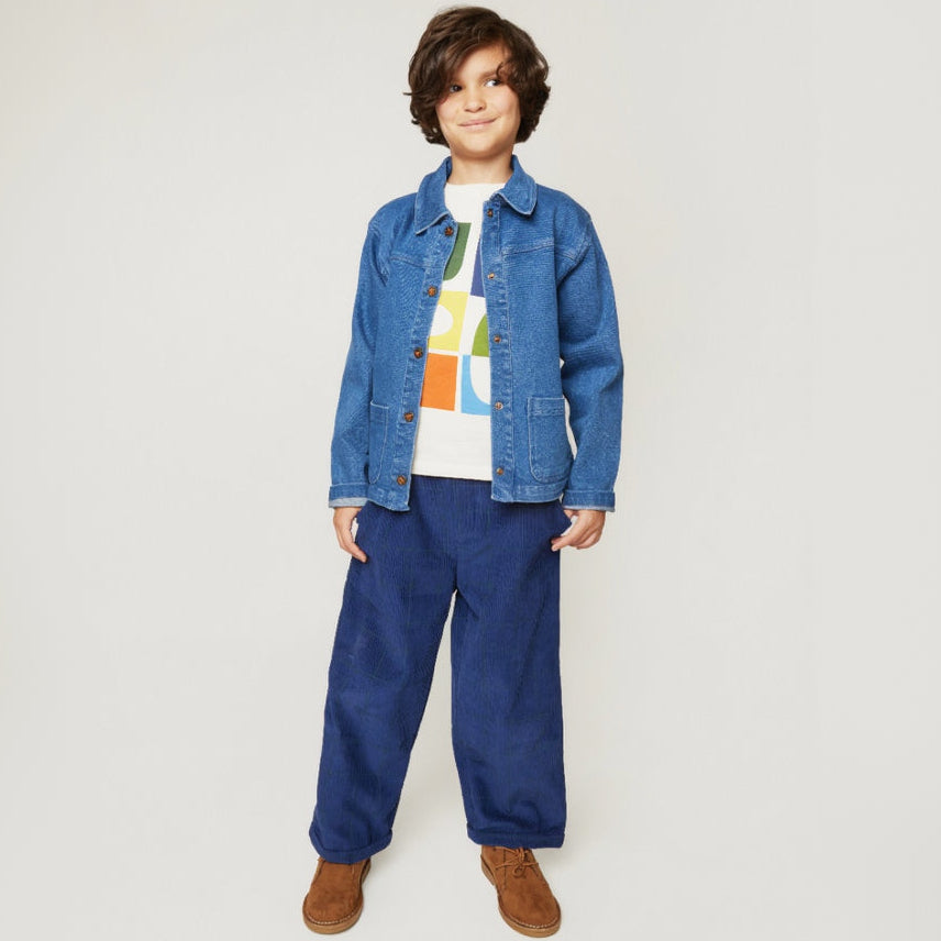 Close-up of Mon Coeur Kids Navy Grid Corduroy Pant showing the subtle grid pattern and soft corduroy texture