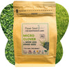 Flawn Seed Kits micro clover and mow less grass seed package with green grass background