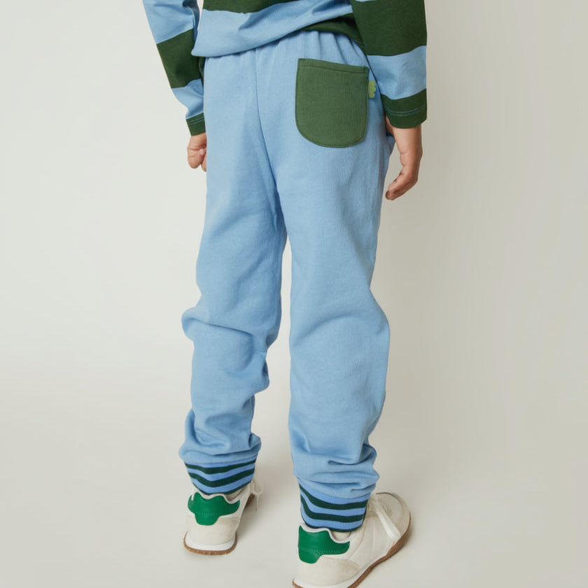 Mon Coeur Blue Jogger styled for children, featuring sporty green striped cuffs and a relaxed fit