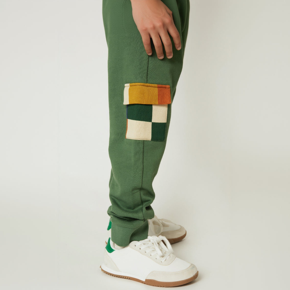 Green checkered pocket jogger by Mon Coeur worn by a child, full length view