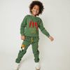 Mon Coeur kids green jogger pants with checkered pockets, styled on a child