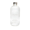 Clear mouthwash bottle with silver cap on a white background
