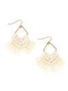 Close-up of handcrafted cream macrame earrings by Fair Anita, showing recycled brass hardware and woven cotton macrame detail