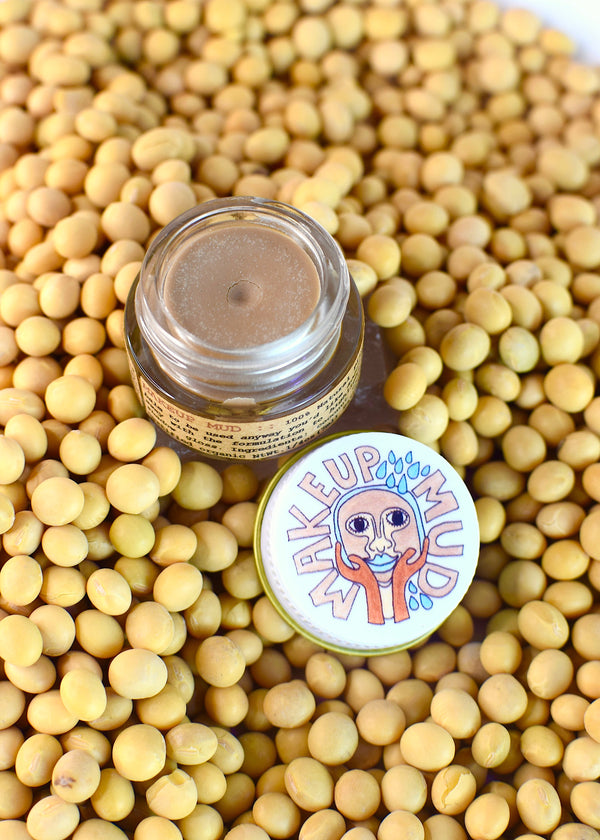 Makeup Mud jar next to packaging