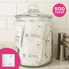 Jar filled with Freedom brand makeup remover packets on a bathroom counter.