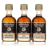 Three bottles of Barrel Aged Vermont Maple Syrup Sampler labeled Bourbon, Rye, and Single Malt