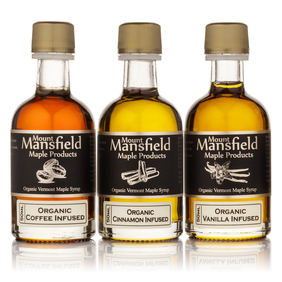 Close-up of the three infused maple syrup bottles included in the Vermont Maple Syrup Sampler Set