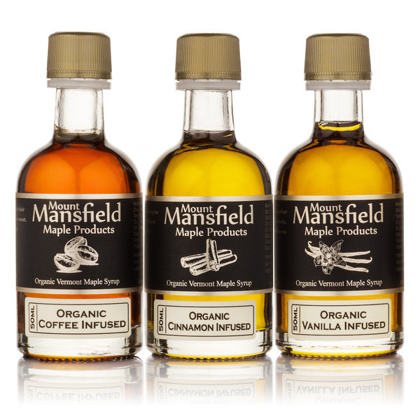 Close-up of the three infused maple syrup bottles included in the Vermont Maple Syrup Sampler Set