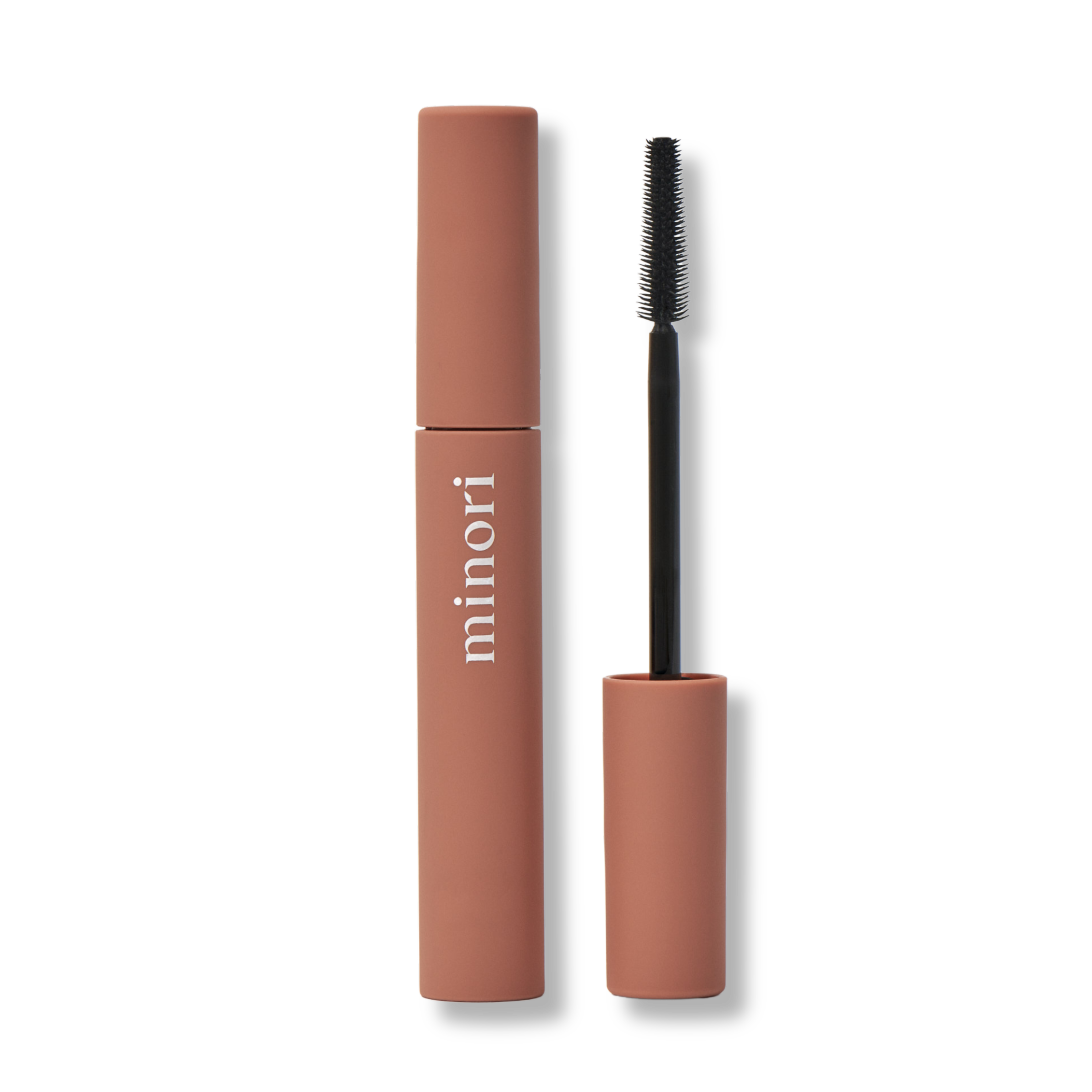 Minori Beauty Mother of Lashes natural mascara tube and precision brush on neutral background