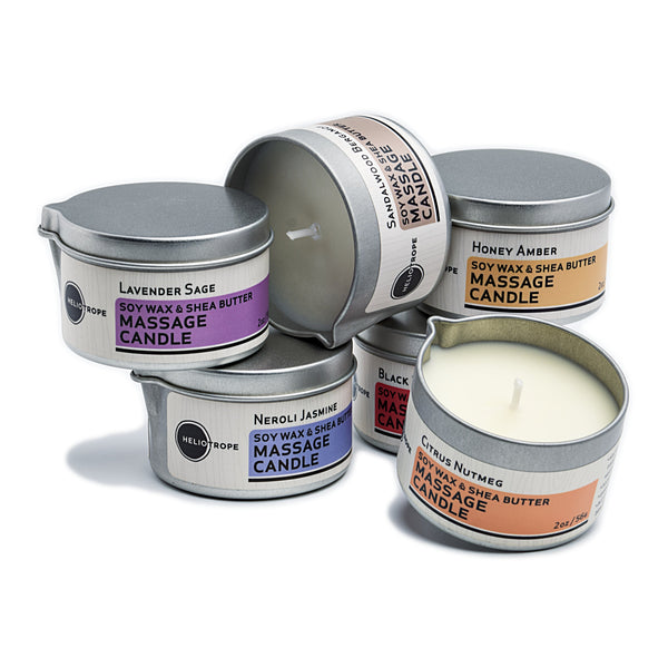 Stack of Heliotrope SF massage candles with pour spout showing warm melted oil