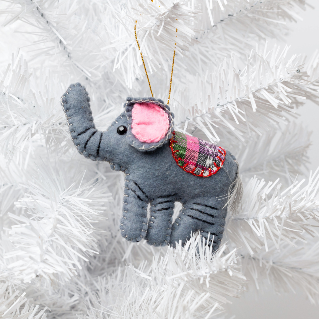 Add a touch of whimsy to your home with our adorable Felt Elephant Ornament. Made from sustainable materials and featuring vibrant colors, this ornament is perfect for children and adults alike. Order yours today!