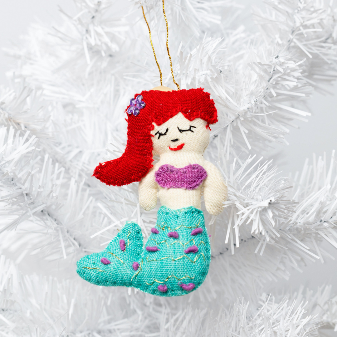 Add a touch of magic to your home with our adorable Felt Mermaid Ornament. Made from sustainable materials and featuring vibrant colors, this ornament is perfect for children and adults alike. Order yours today!