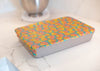 Rectangular box with colorful floral pattern on a marble surface