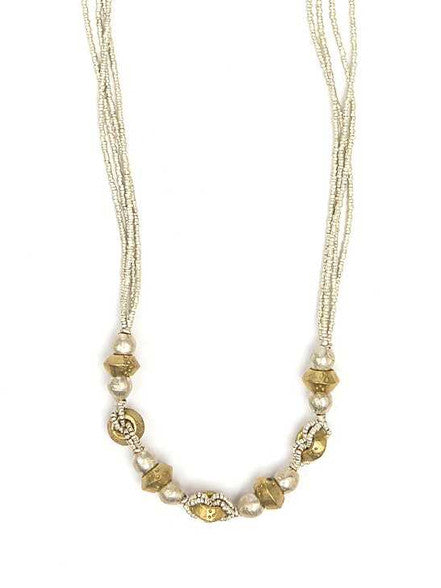Necklace with gold and pearl beads on a white background