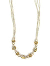 Necklace with gold and pearl beads on a white background