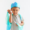 Child wearing a blue and green costume with a white background