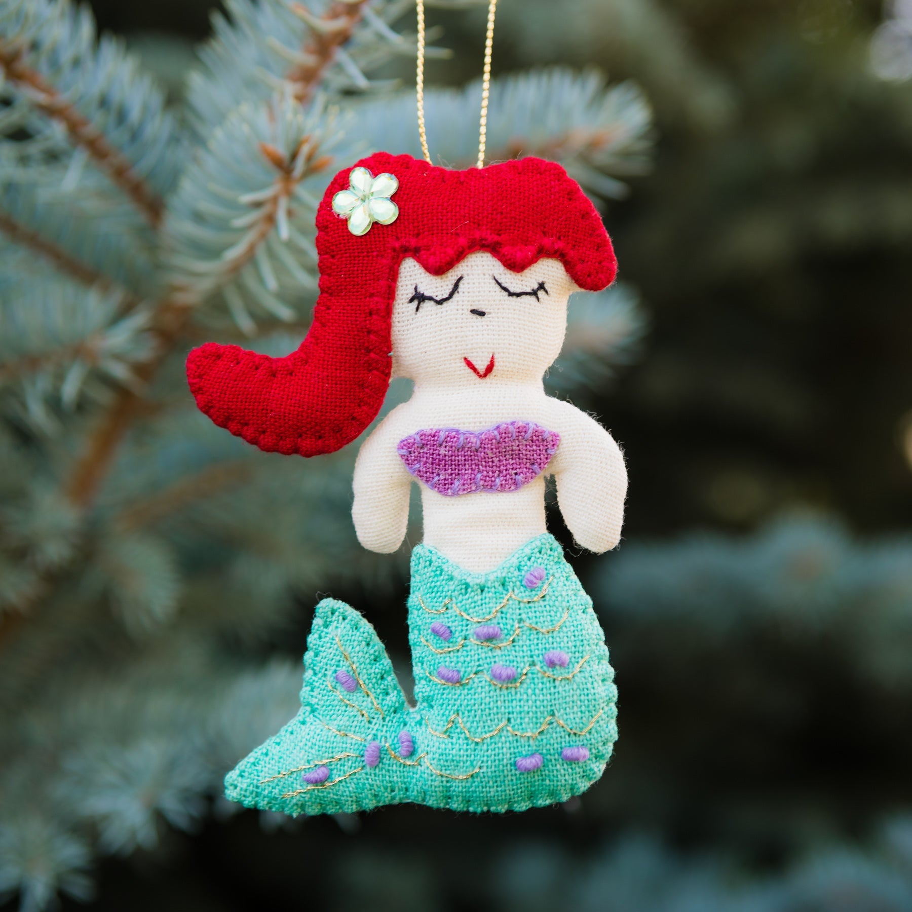 Add a touch of magic to your home with our adorable Felt Mermaid Ornament. Made from sustainable materials and featuring vibrant colors, this ornament is perfect for children and adults alike. Order yours today!