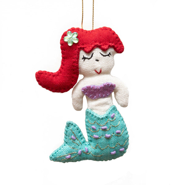 Add a touch of magic to your home with our adorable Felt Mermaid Ornament. Made from sustainable materials and featuring vibrant colors, this ornament is perfect for children and adults alike. Order yours today!