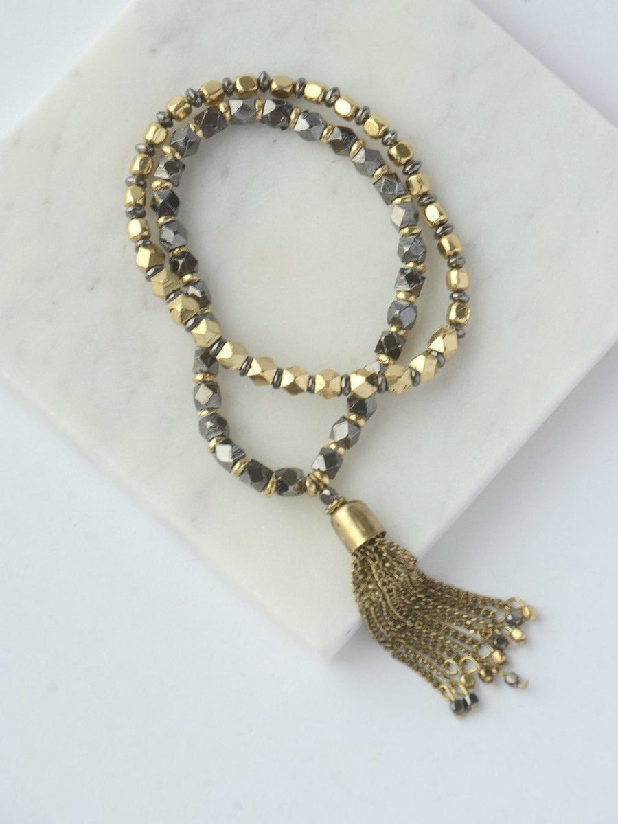 Metal tassel elastic bracelets in dark tones, handmade fair trade bracelet stack