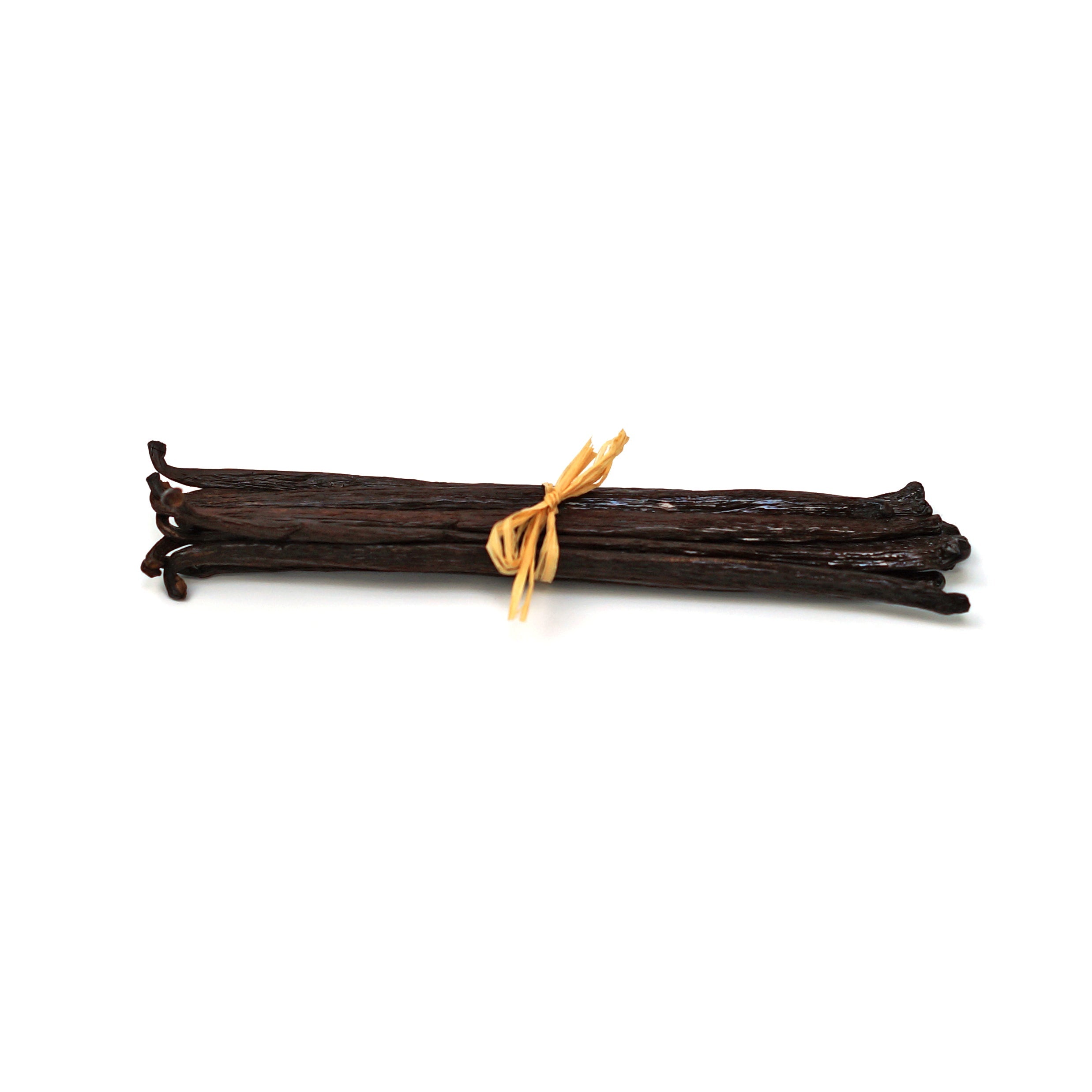 Bunch of vanilla beans tied with a yellow string on a white background