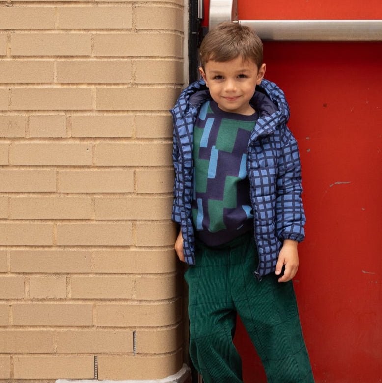 Child wearing the Mon Coeur Blue Grid Puffer jacket, styled for autumn layering