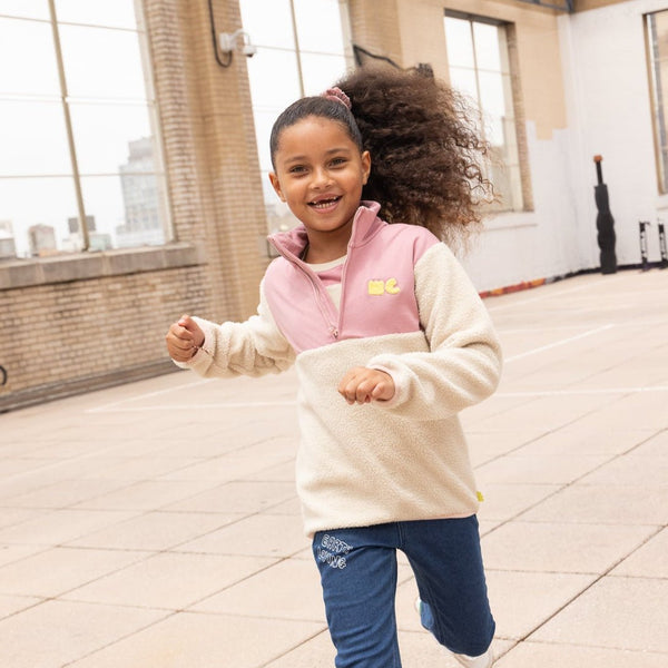 Child wearing Mon Coeur Pink Sherpa Zip Up recycled organic cotton fleece, styled for autumn