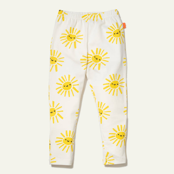 White pants with yellow sun patterns on a white background
