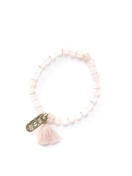 Close-up of Mother's Love Stone Bracelet in rose quartz with mom pendant, Fair Anita Peru Collection