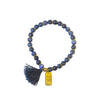Close-up of Mother's Love Sodalite Bracelet showing hand-stamped mama charm and tassel detail