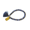 Dark blue sodalite beaded elastic bracelet with tassel and hand-stamped mama pendant by Fair Anita