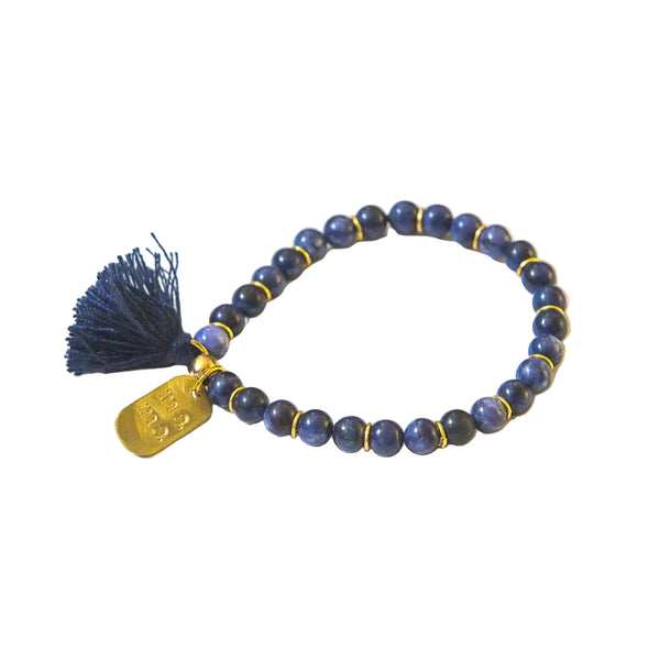 Dark blue sodalite beaded elastic bracelet with tassel and hand-stamped mama pendant by Fair Anita