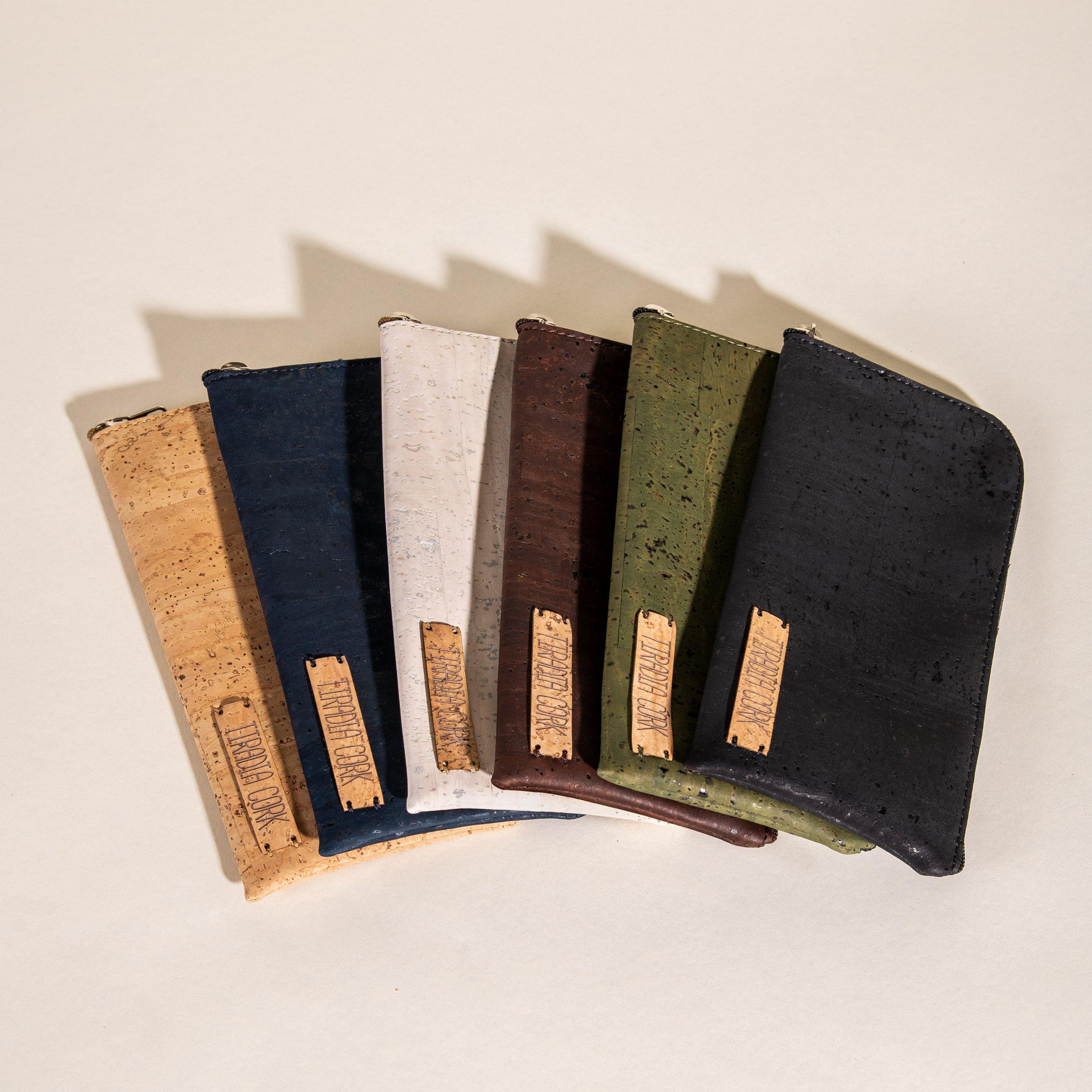 Set of five cork coasters with natural cork trim on a beige background