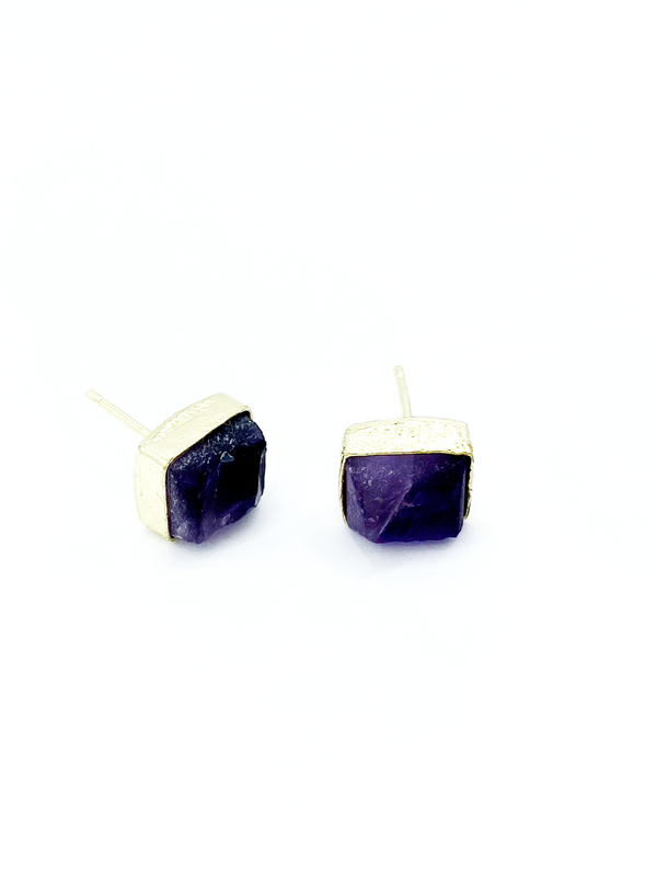 Close-up of uncut amethyst rectangle studs in recycled brass-plated brass setting, nickel-free