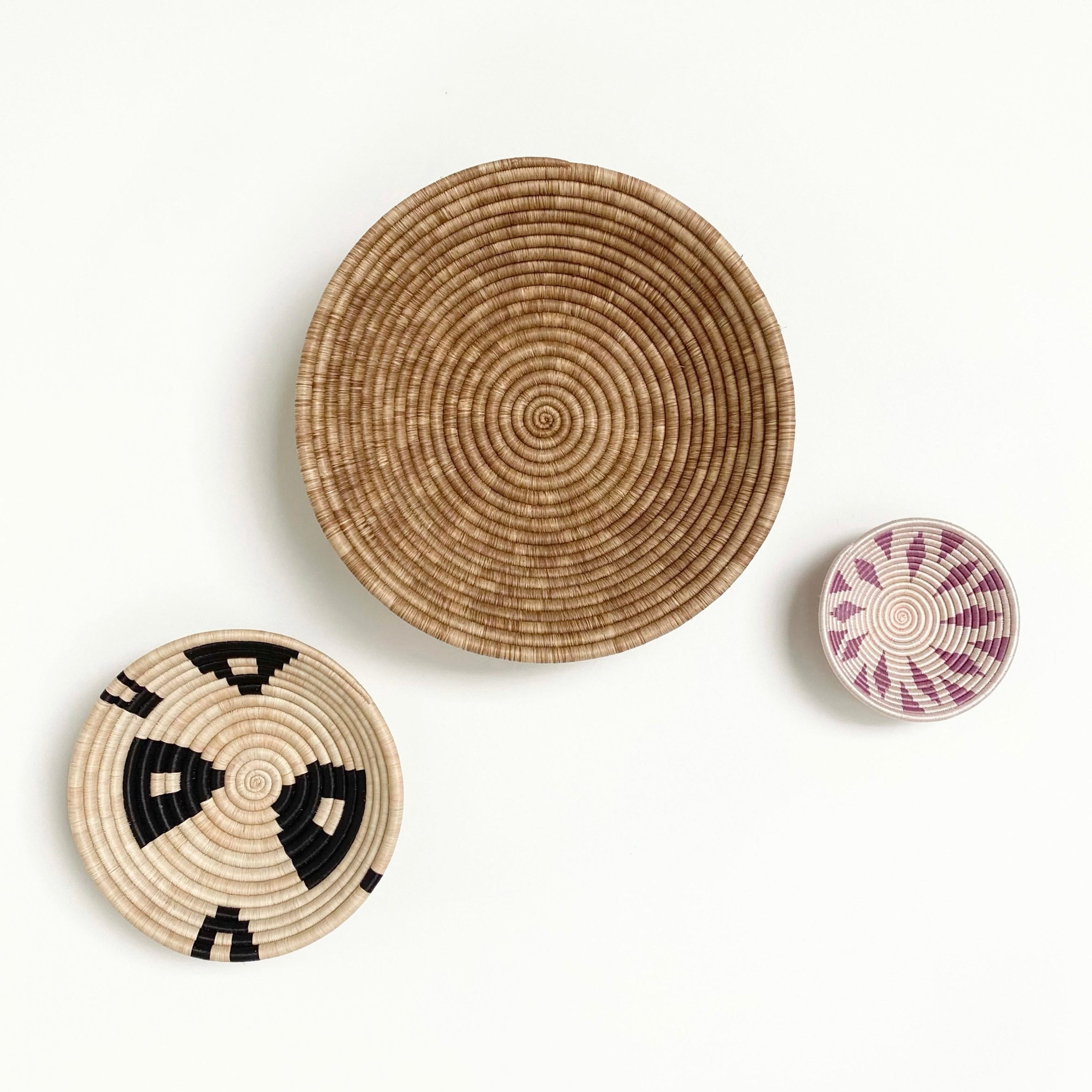 Close-up detail of large natural woven sisal wall basket showing texture and weave pattern